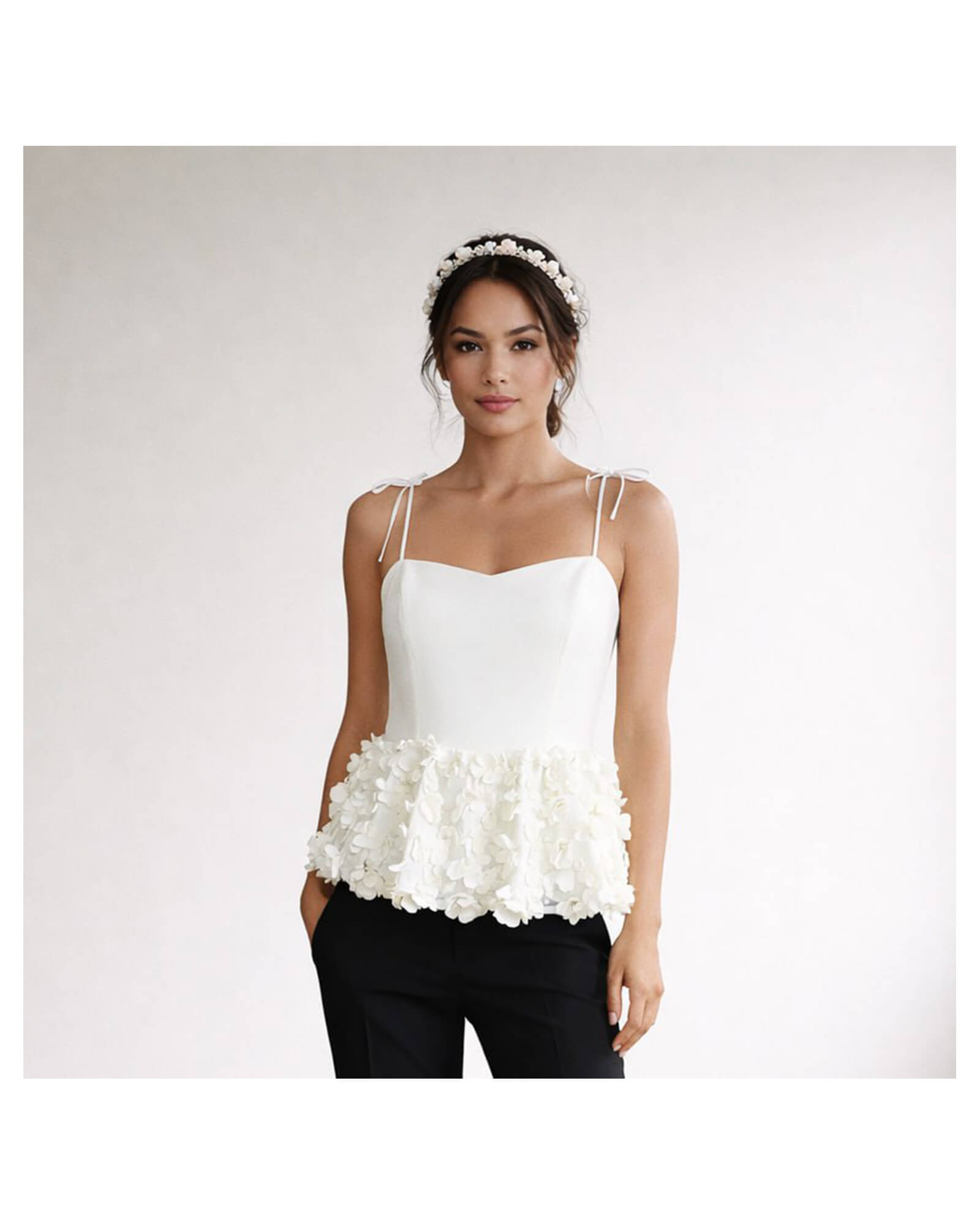 Hand-embellished white crepe peplum top with floral appliqués and tie straps