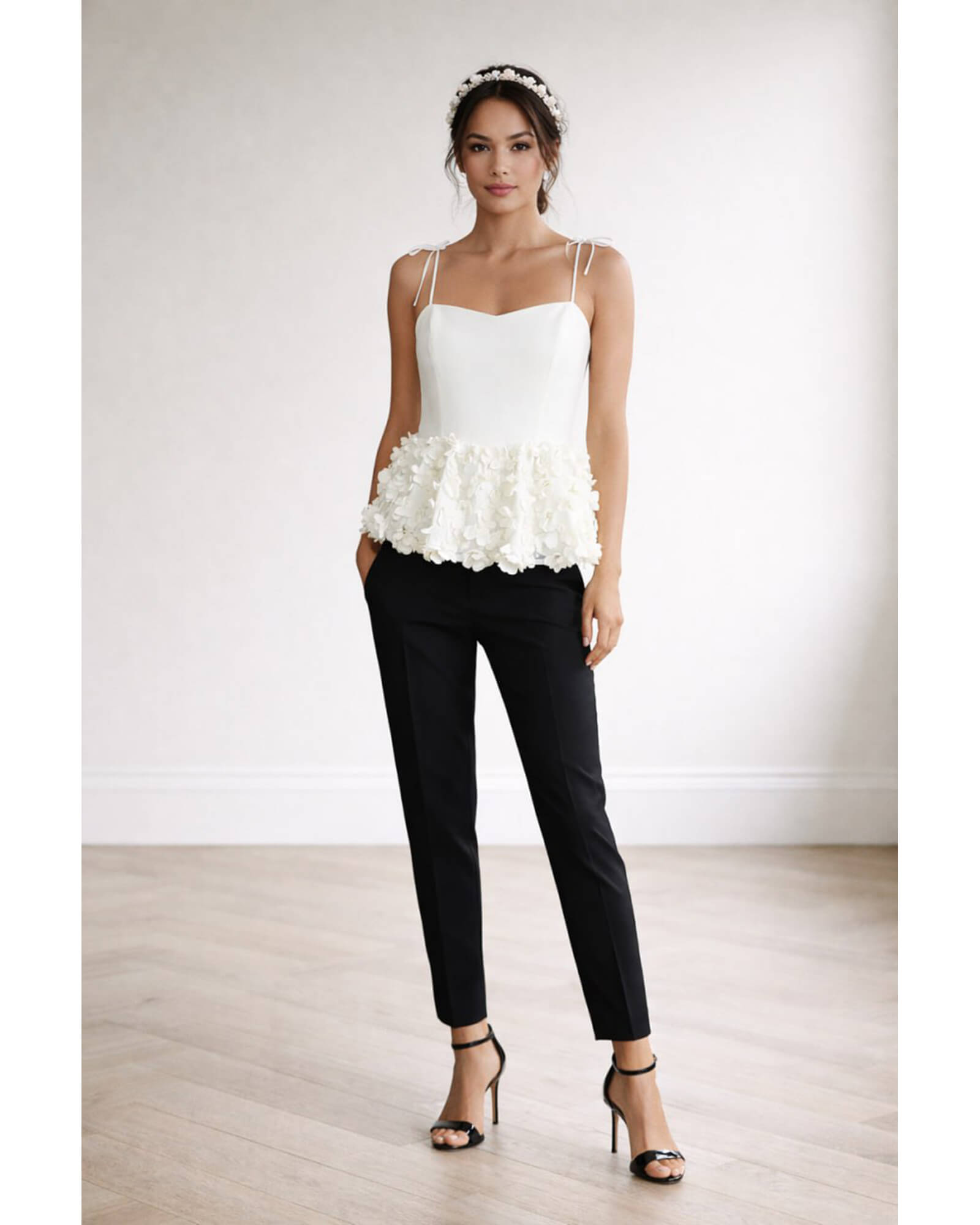 Hand-embellished white crepe peplum top with floral appliqués and tie straps
