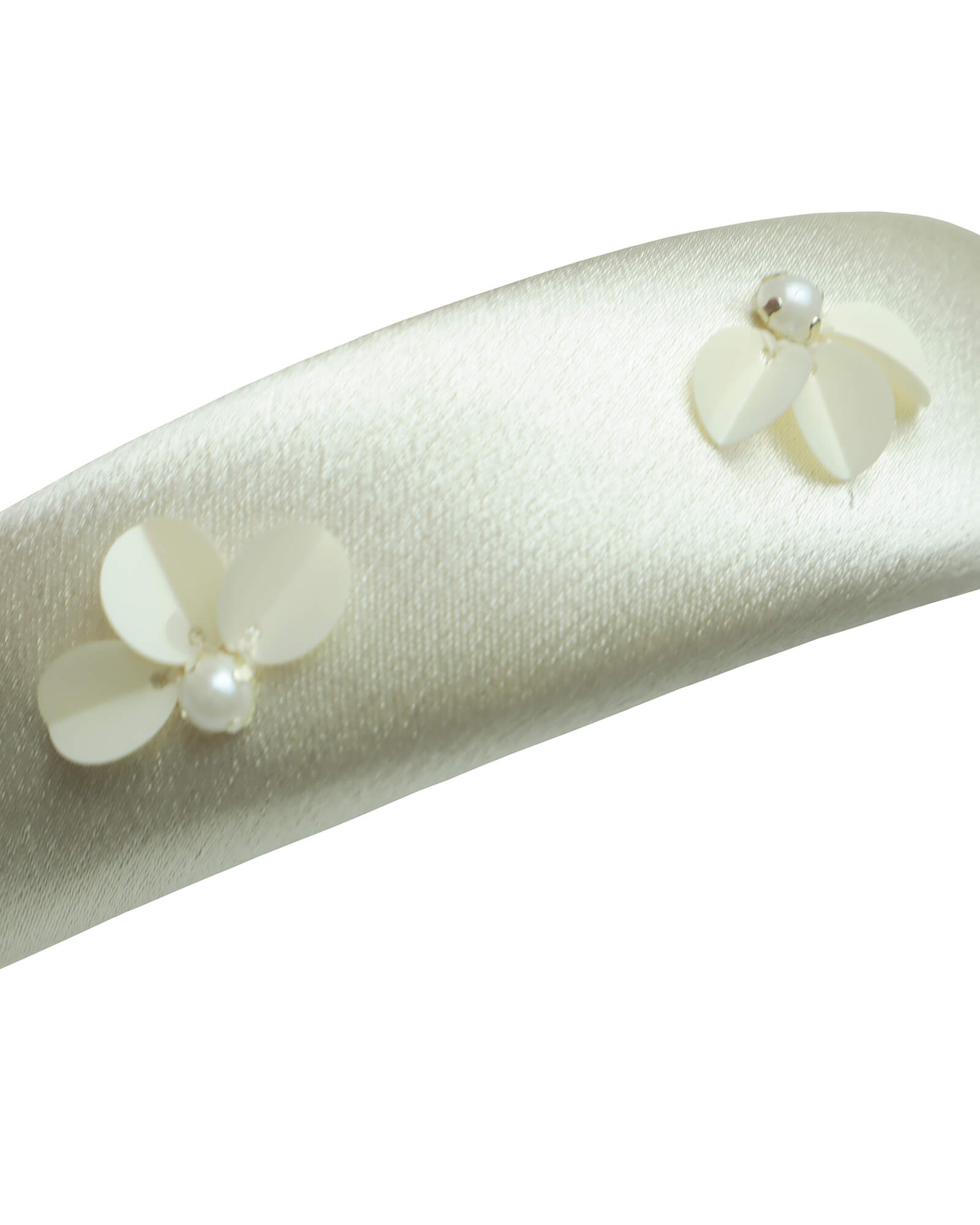 Luxurious ivory satin padded headband, hand-embellished with dimensional sequin flowers and silver-capped pearls. Front three-quarter view showing the intricate craftsmanship and comfort padding.